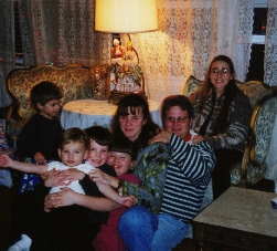 Pile-on at Grandma Patricola's on Christmas Eve 1998